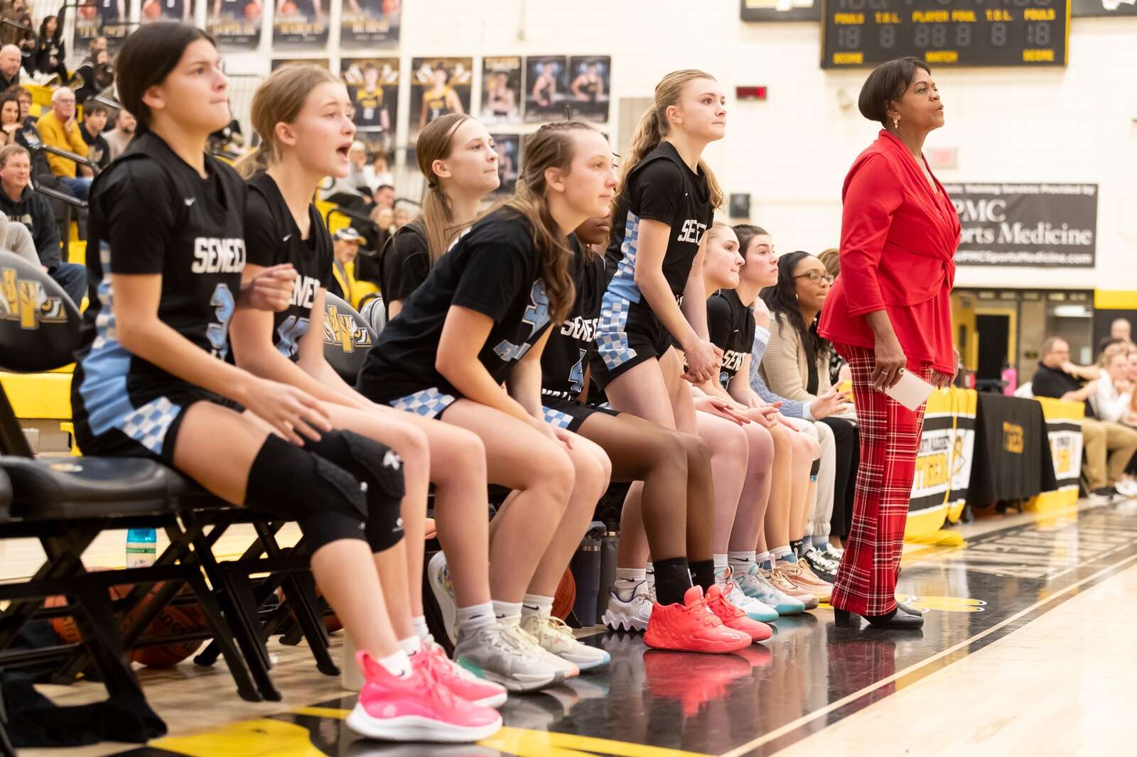 Seneca Valley head coach Dorothea Epps and her bench watch the action