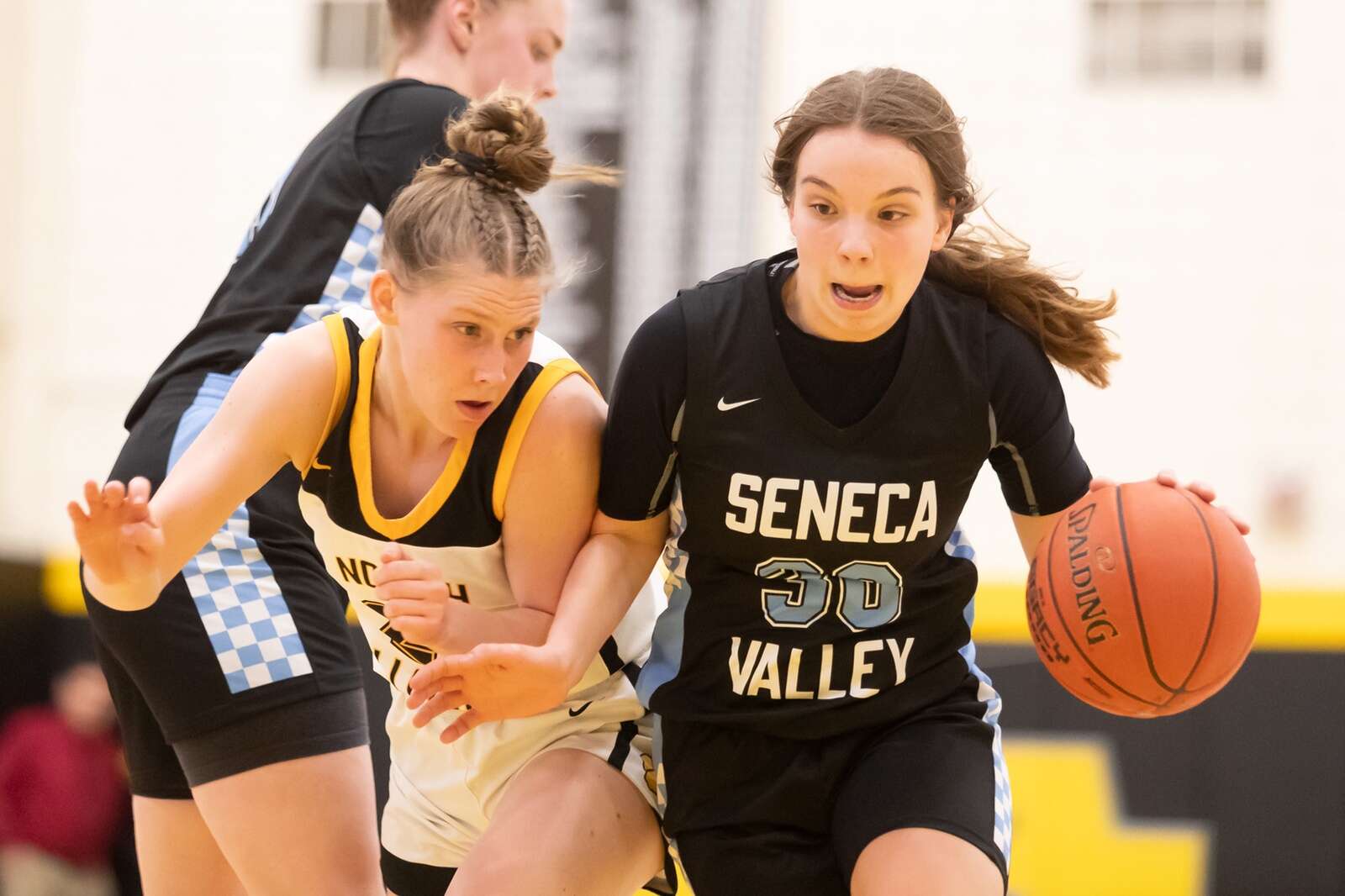 Gracie Cato drives on North Allegheny’s Grace Heliger