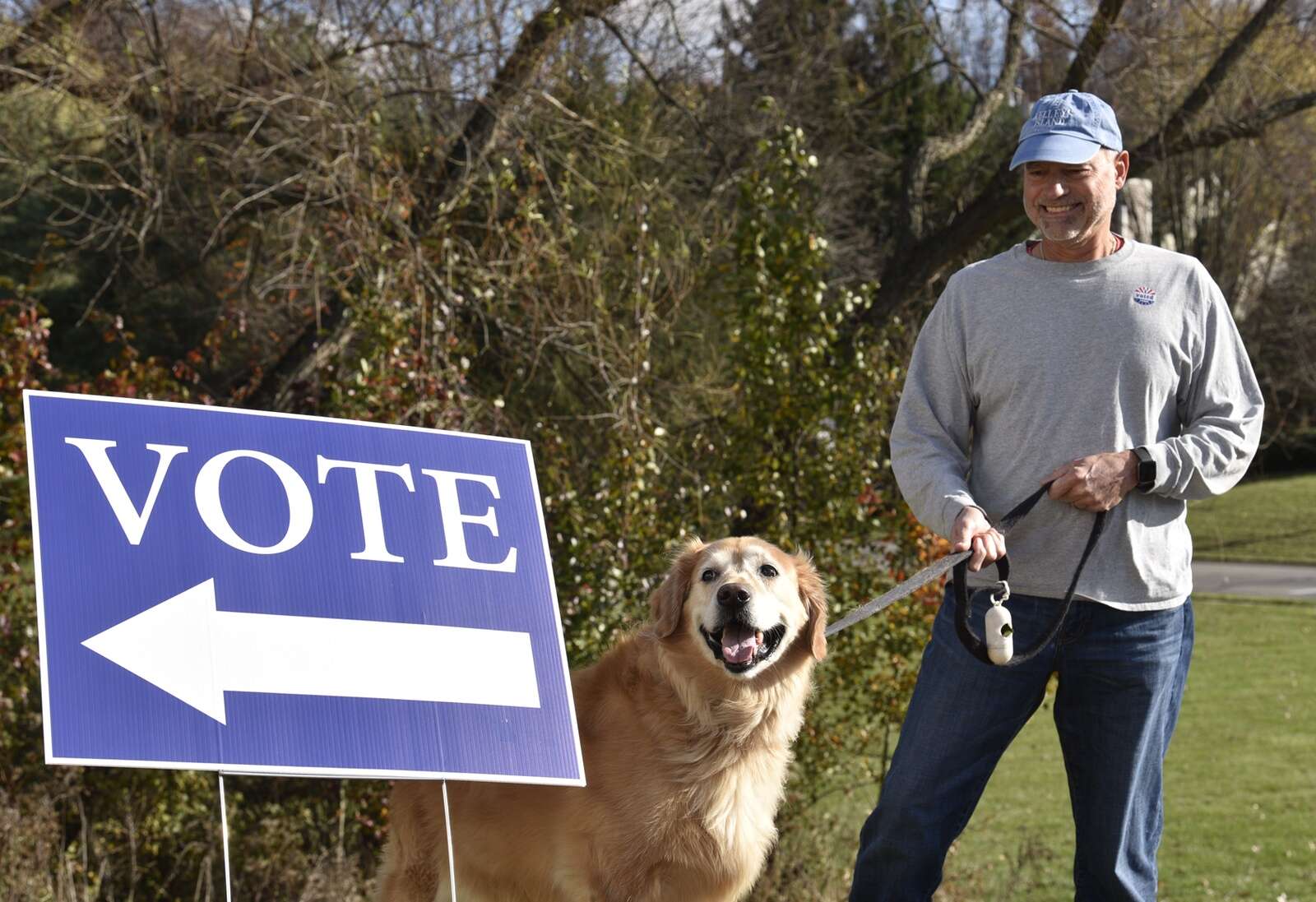 Chuck Seibel and his dog prepare to enter the polling station