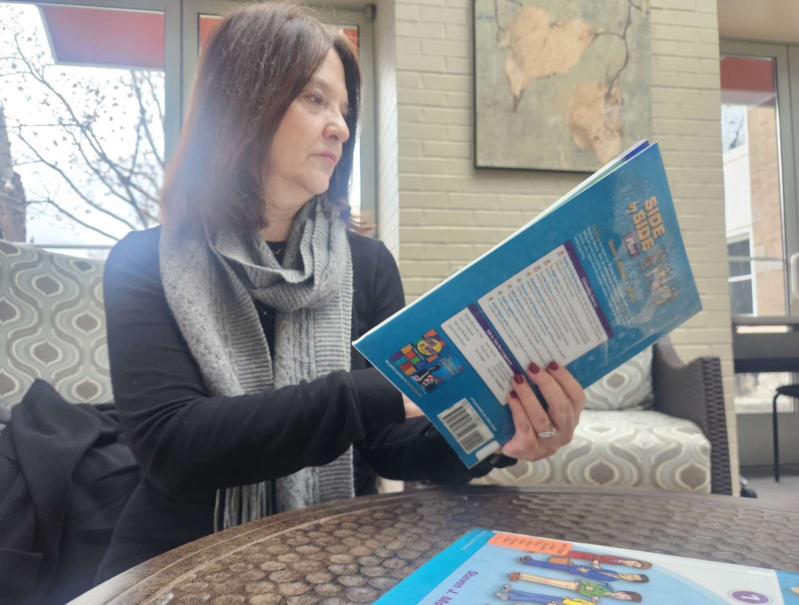 Arlene Gardopee looks through a workbook