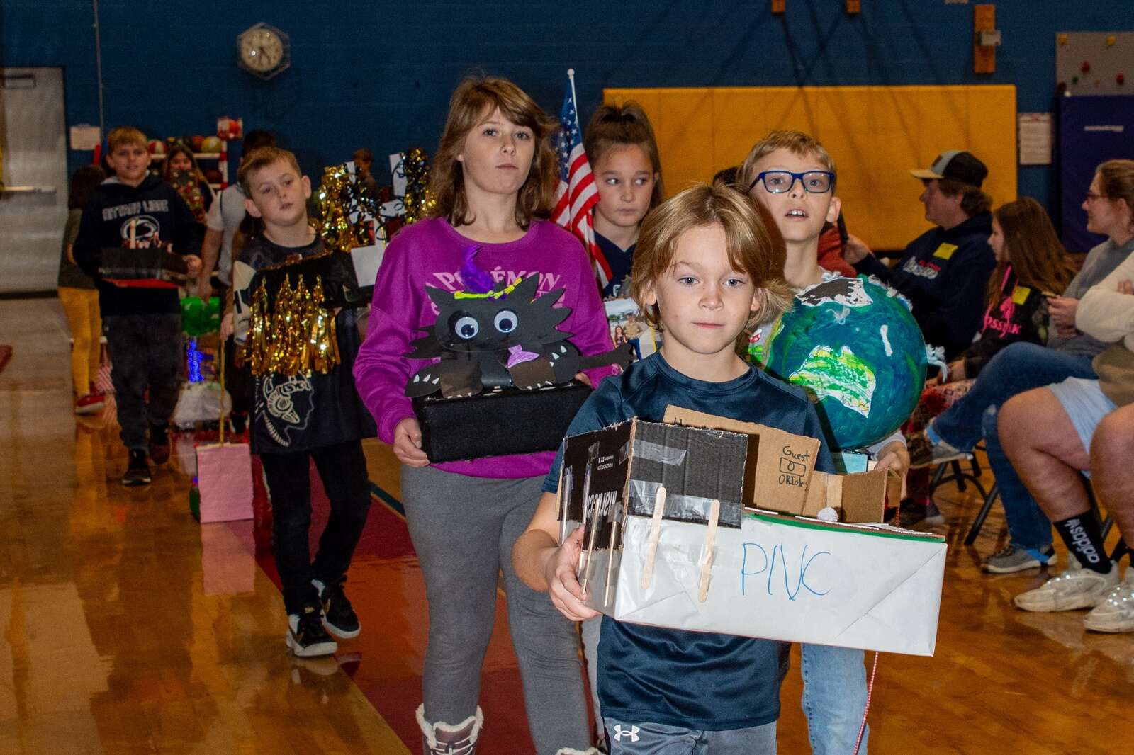 Students at Knoch Primary School delight their parents with a Thanksgiving Parade