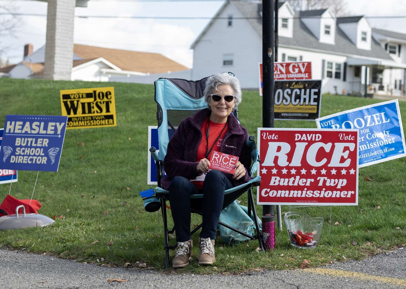 Fugi Sisca sits surrounded by campaign signage