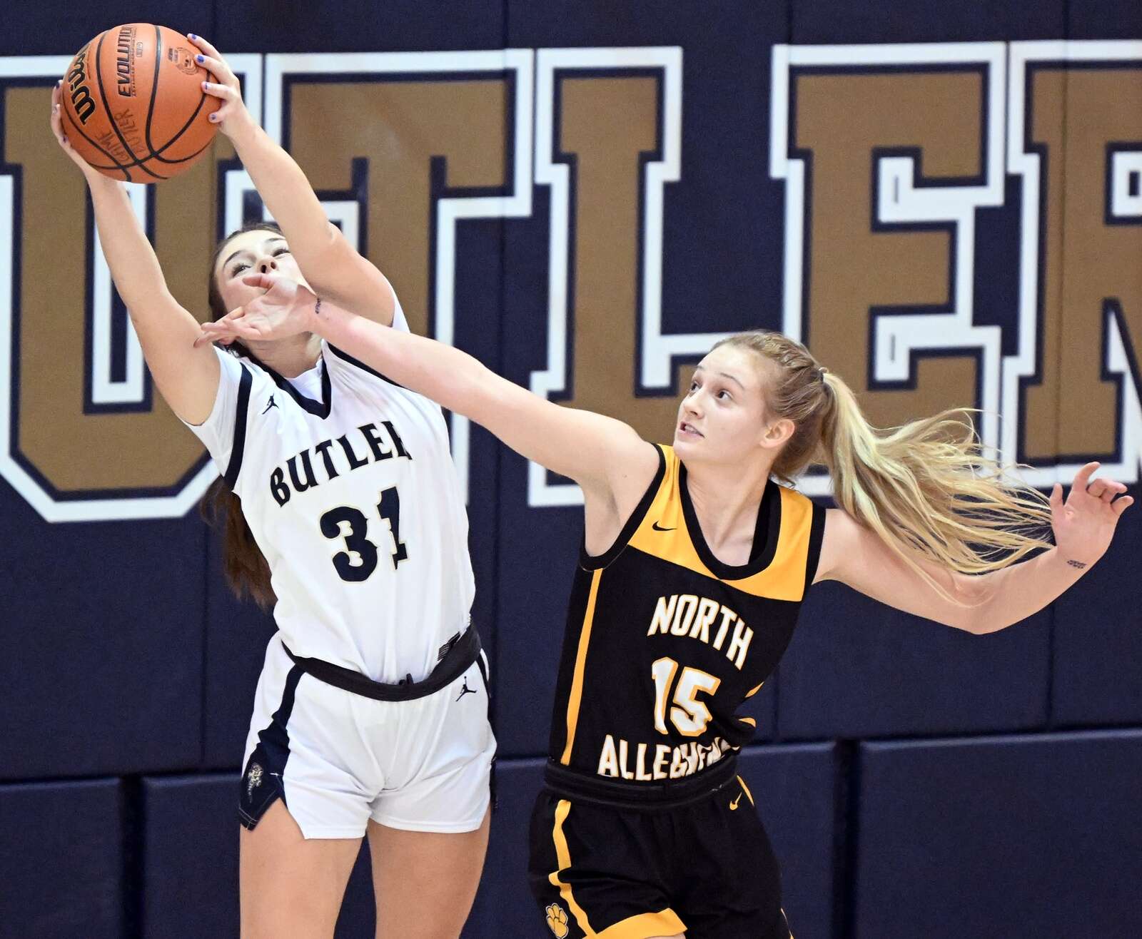 Butler #31 Avery Maier fights for a rebound against  North Allegheny #15 Lydia Betz