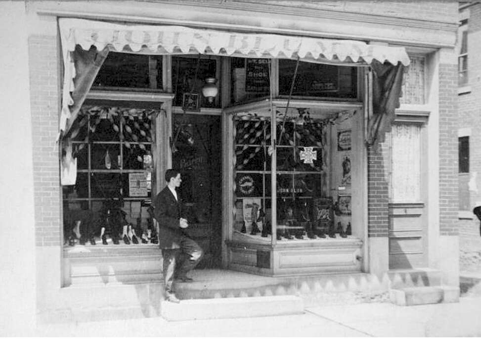 This photo of the former Blum’s Shoe Store in Zelienople, thought to be from the 1920s, was used by a group of Seneca Valley art students to create a mural of the store’s exterior. The man on the stairs is thought to be one of the four generations of Blums who ran the store until its closing around 2000. Submitted Photo