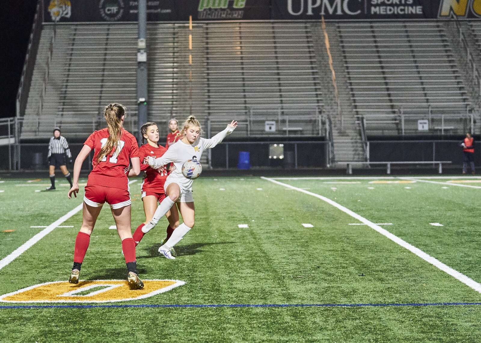 Mars' Brynn Ramsey  keeps the ball away from a Moon player