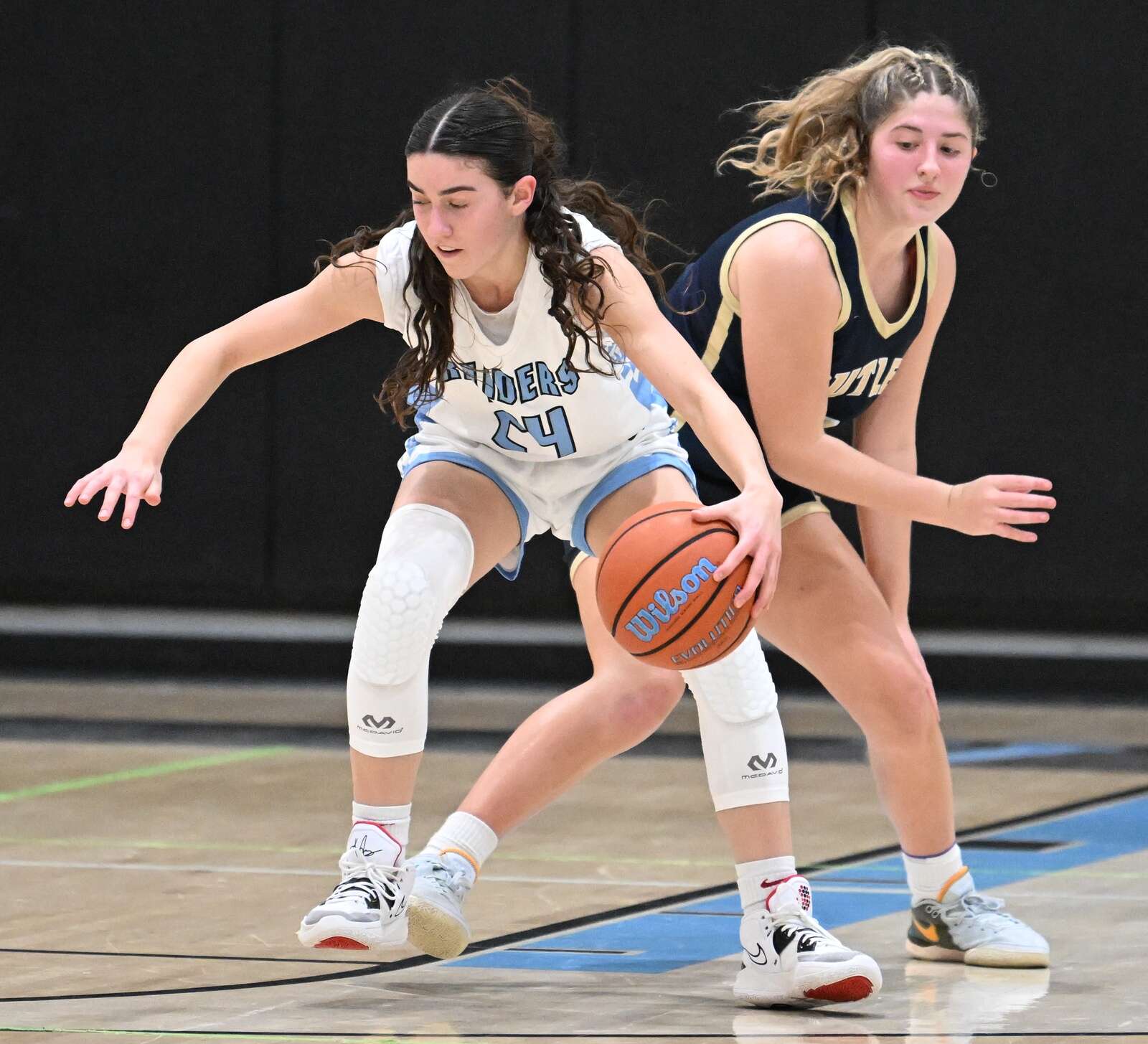 Seneca Valley’s Natalie Hambly fights for a ball against Butler’s Sydney Patterson