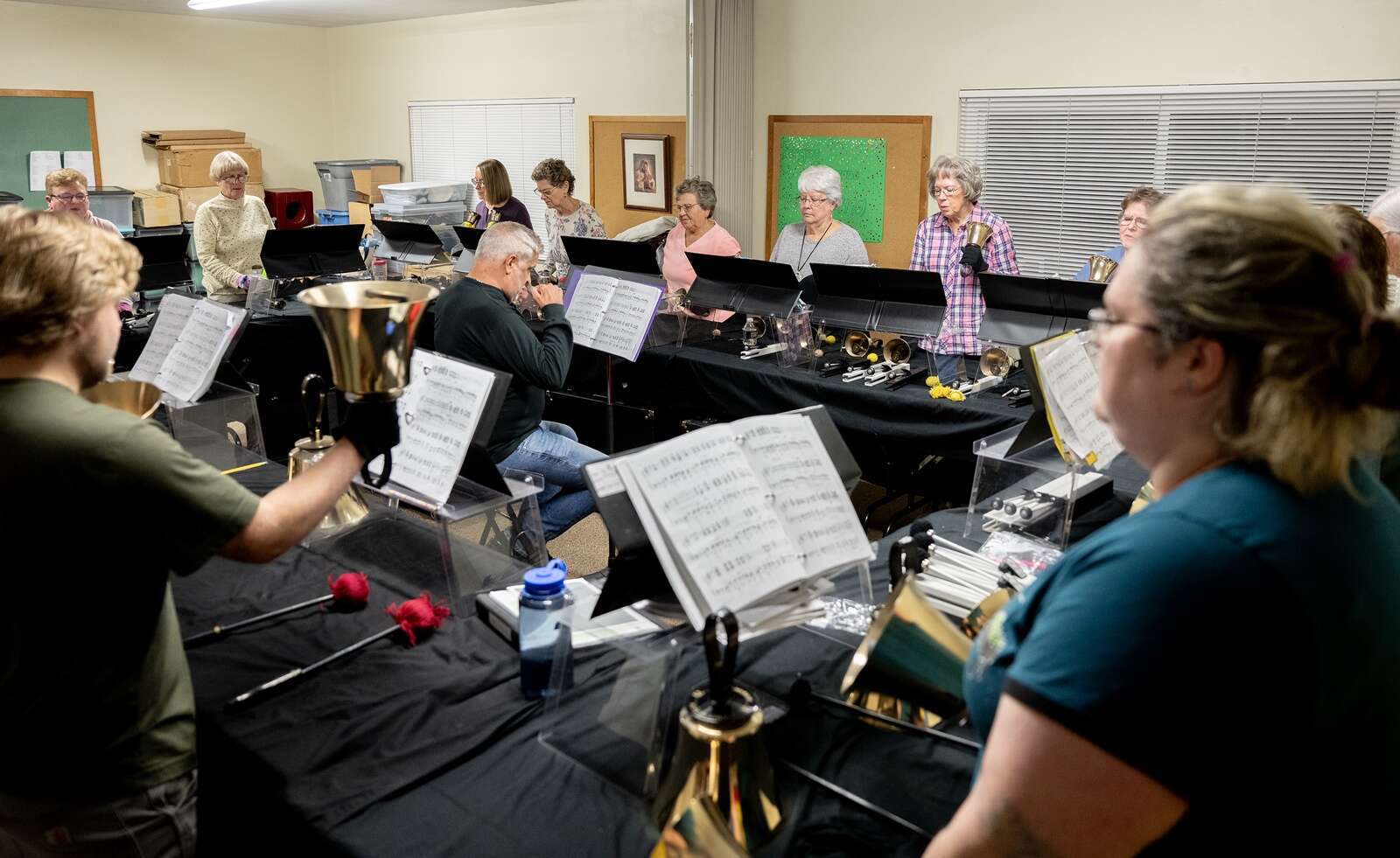 Members of A Circle of Friends bell choir rehearse
