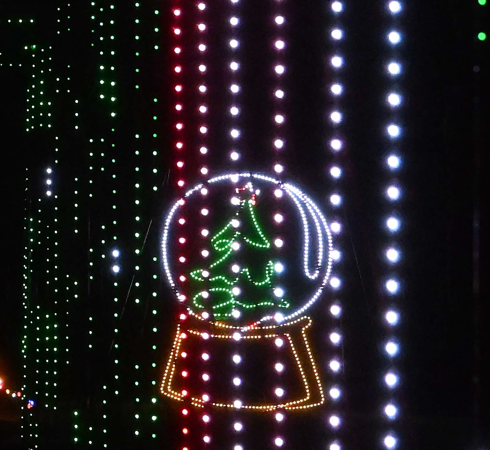 A snow globe is part of the light display at the Big Butler Holiday Spectacular