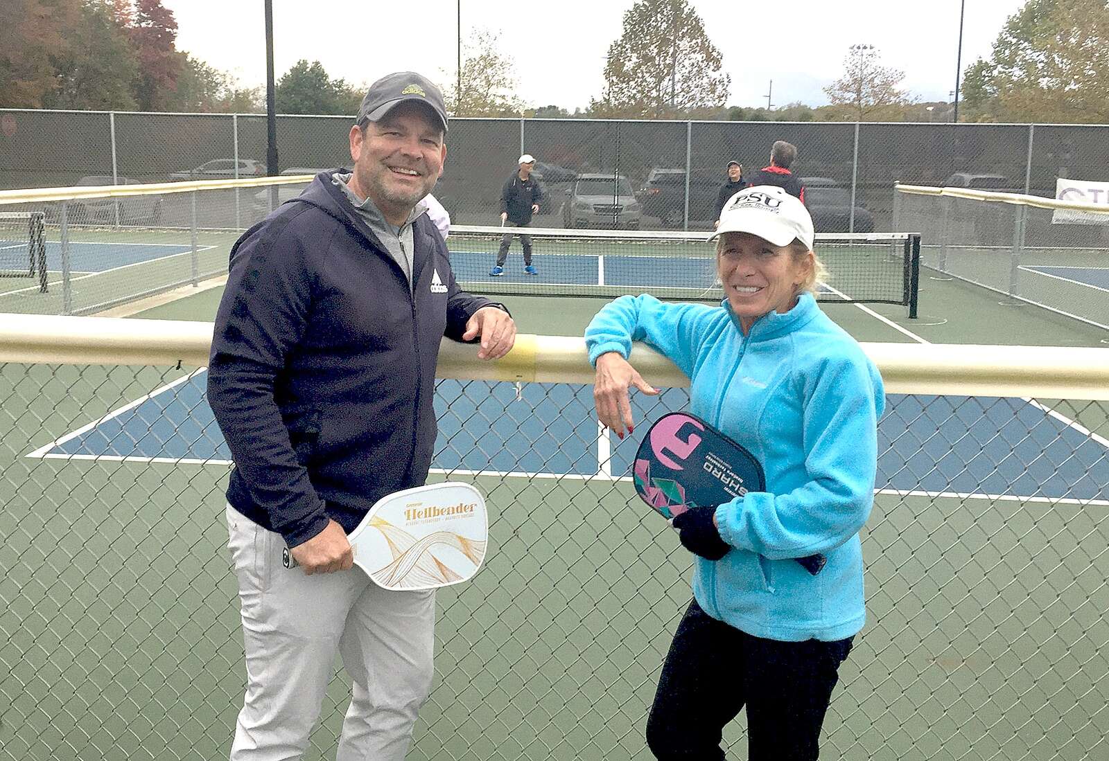 Barry Watkiss and Kathy Hensler take a break during a Pickleball lesson
