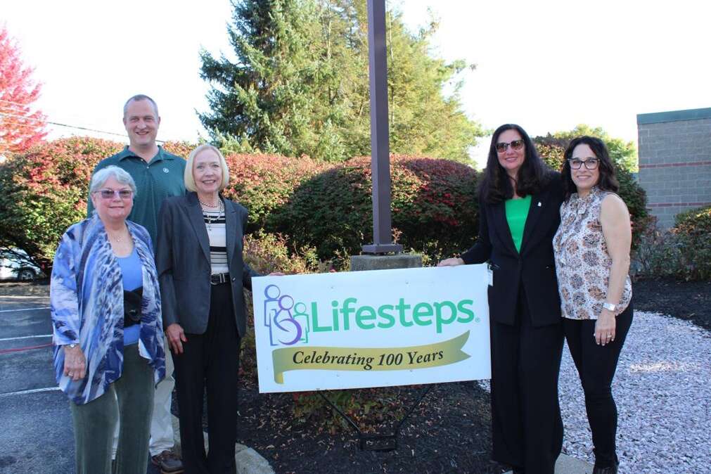 Board members smile while celebrating 100 years of Lifesteps