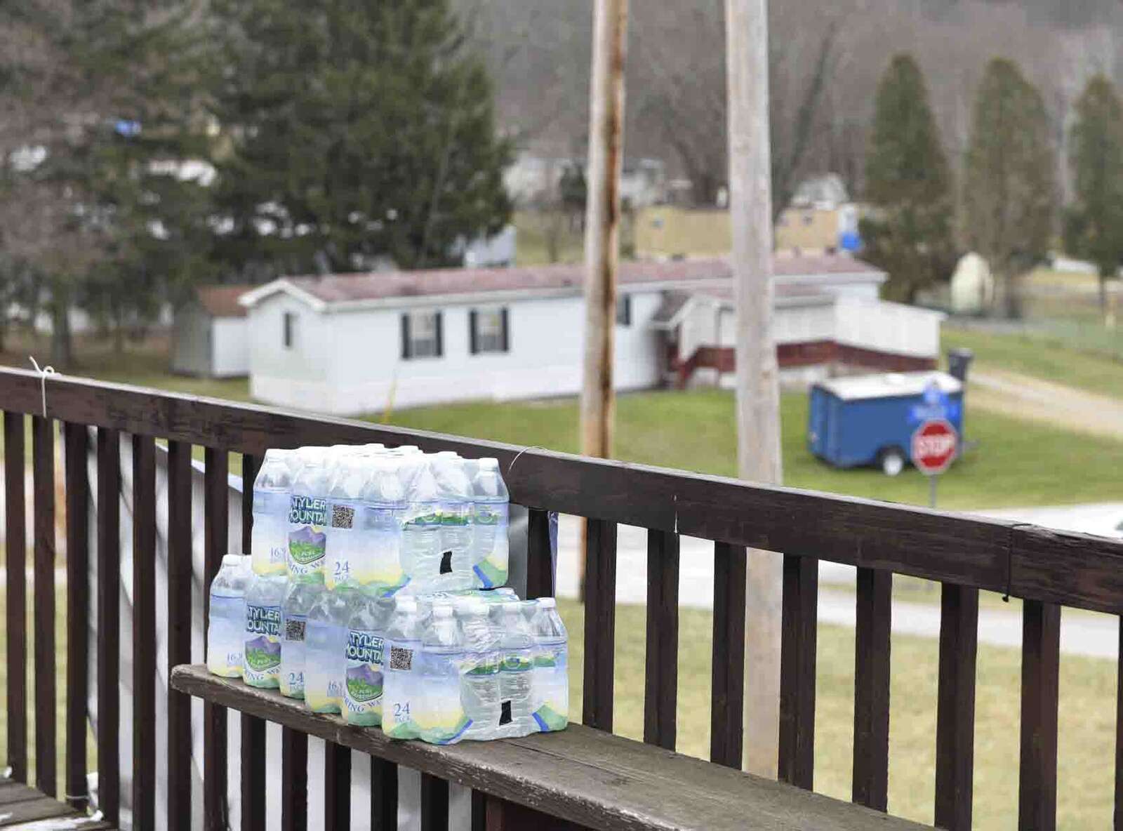 Cases of water sit outside the Mandell Trails Mobile Home Park
