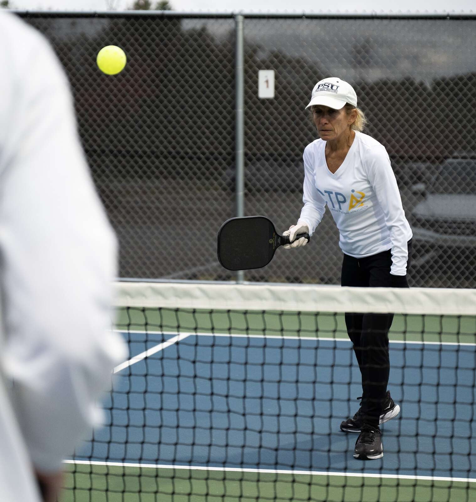 Kathy Hensler provides instruction to pickleball players