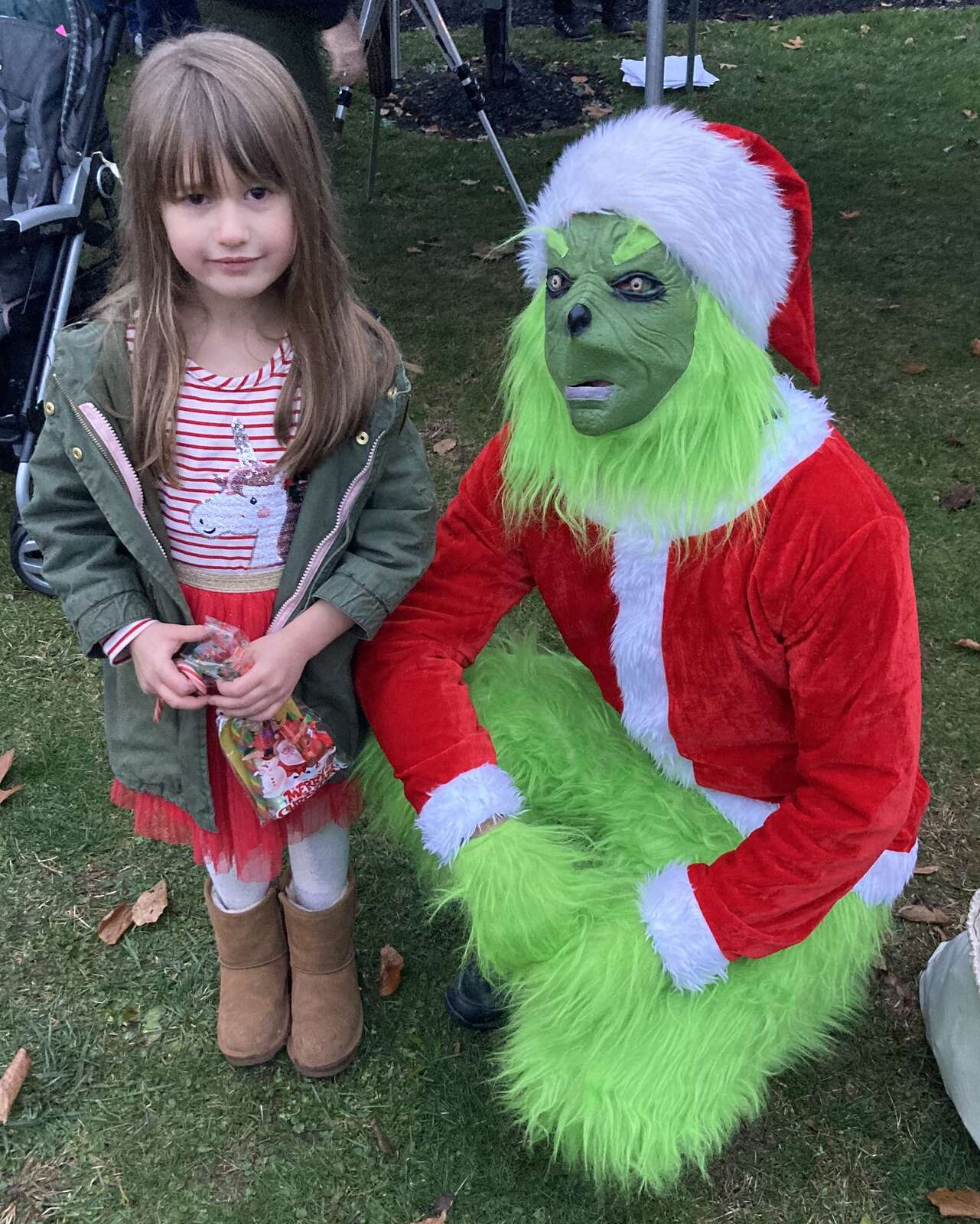 The Grinch stands with children at East Brady’s We Believe Light-Up Night