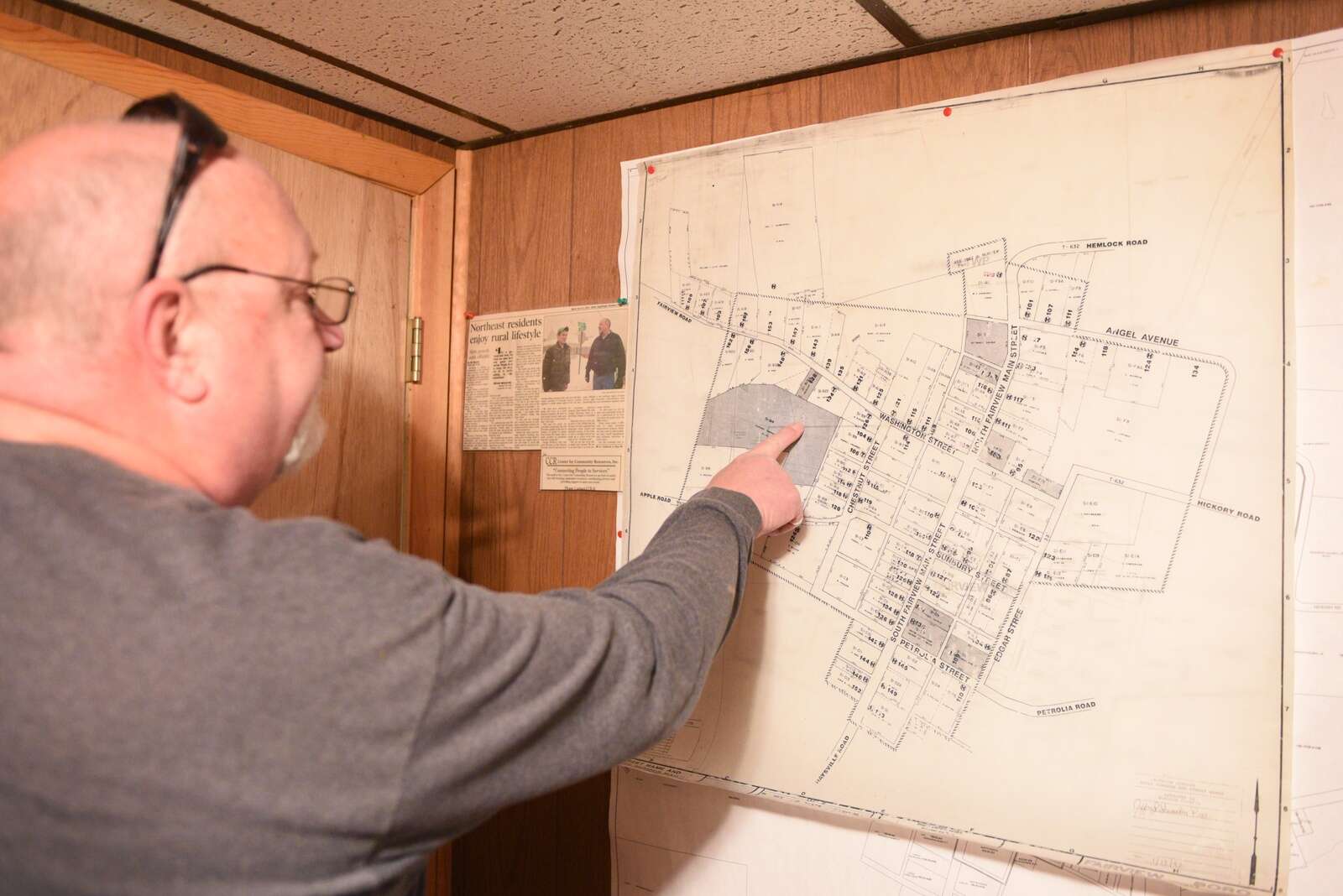 Jeff Shumaker points to a map of Fairview