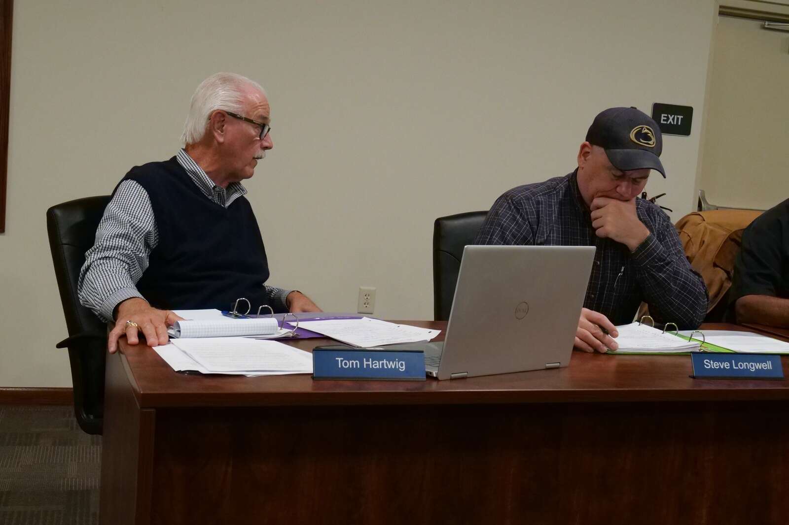 Tom Hartwig and Steve Longwell deliberate at the township supervisors meeting