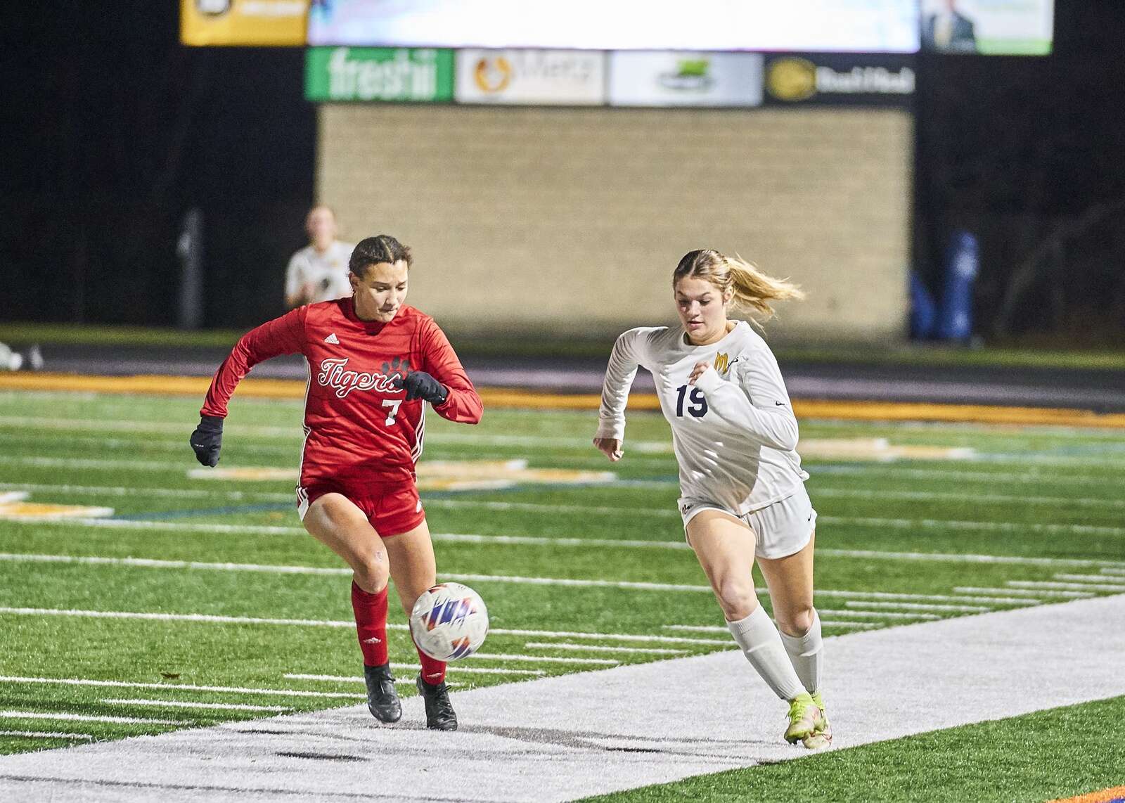Mars' Alivia Halliday moves the ball down the sideline