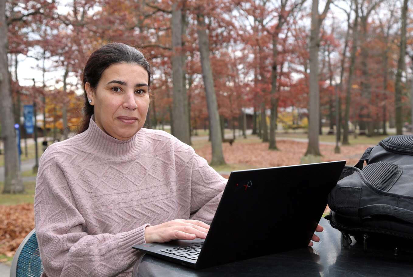 Khadija Akhouad works on her laptop at  BC3’s main campus