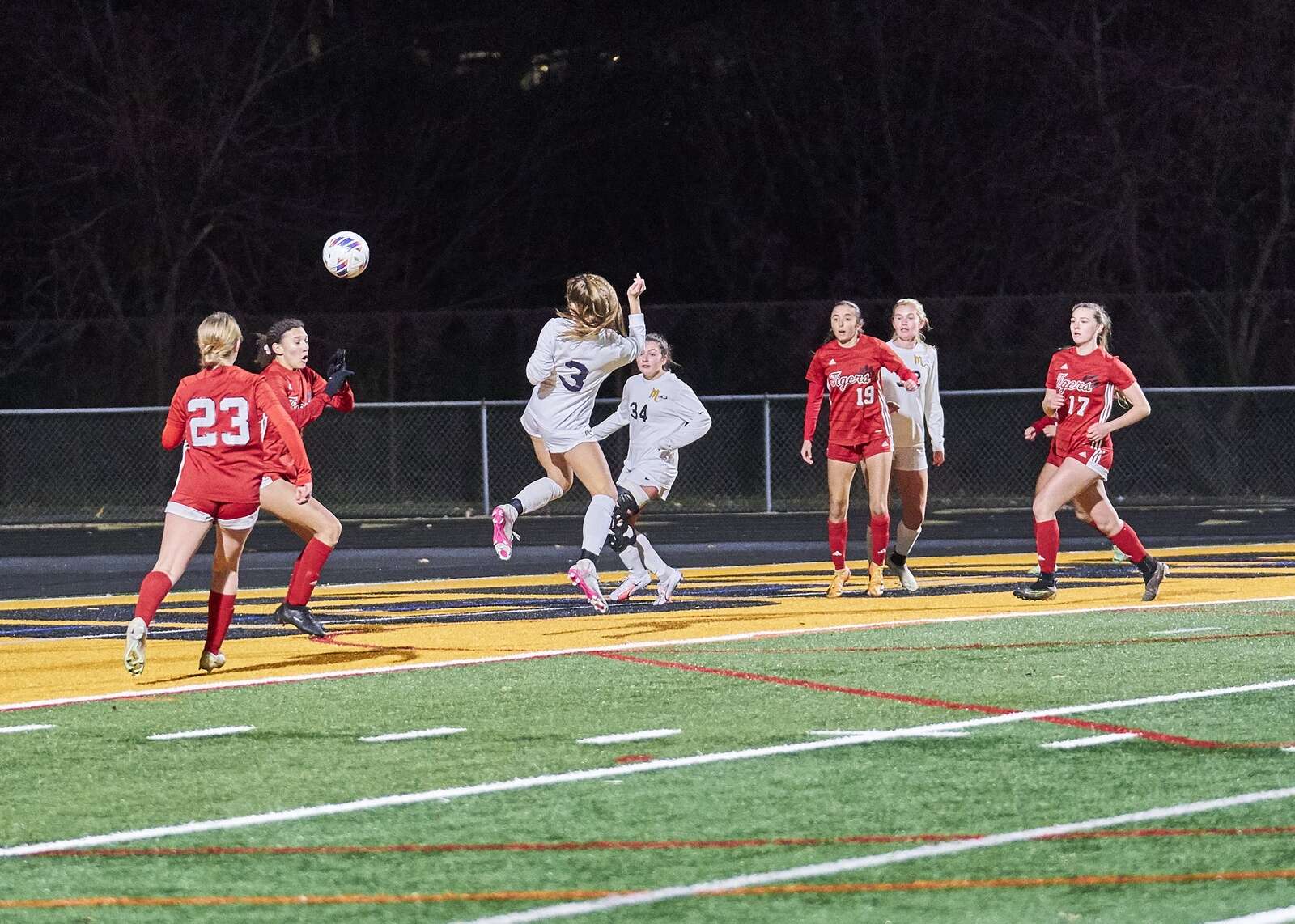 Mars' Addison Girdwood deflects the ball towards the Moon goal