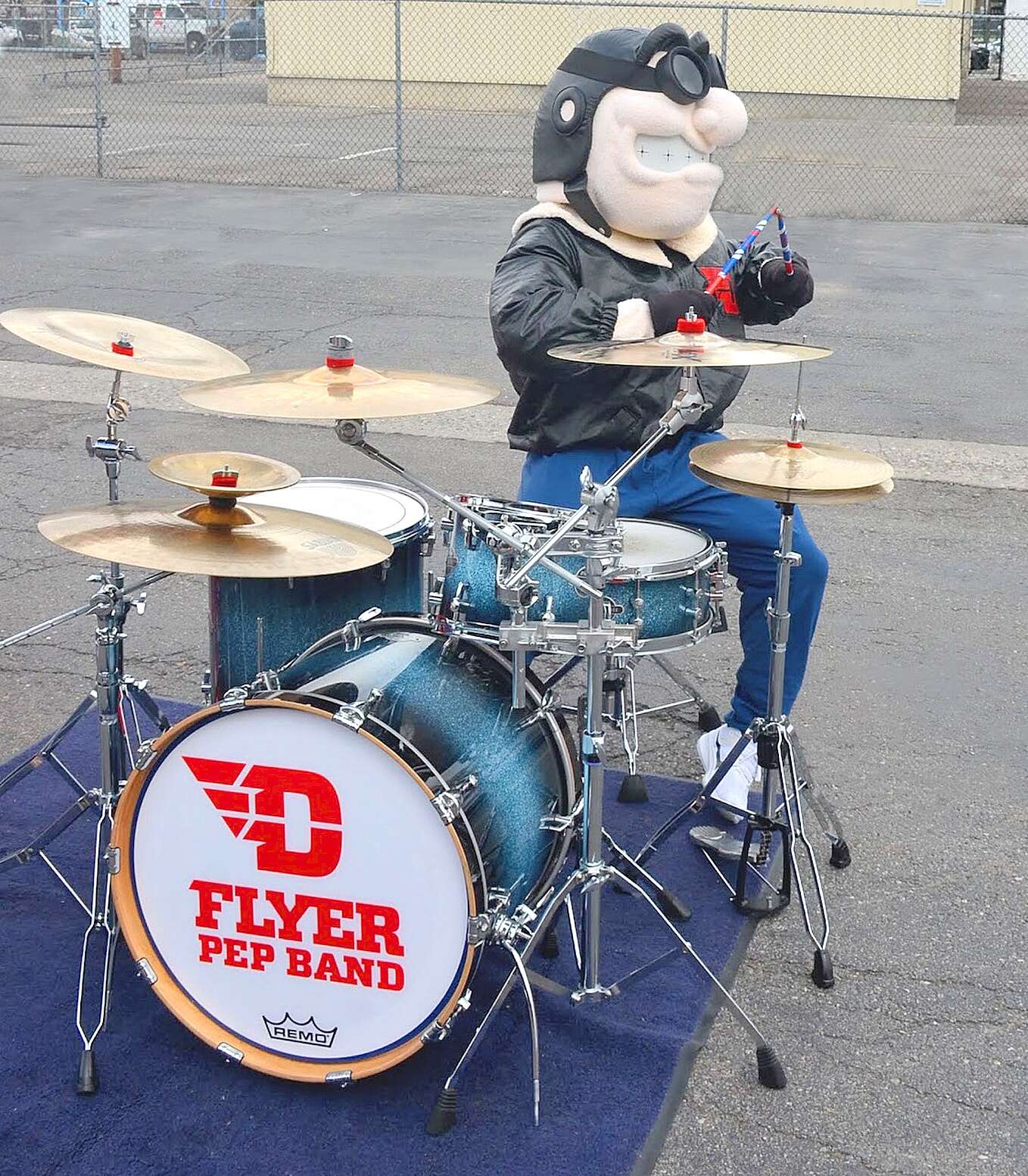 Rudy Flyer, the University of Dayton’s mascot, tries his hand at the drums. Submitted Photo