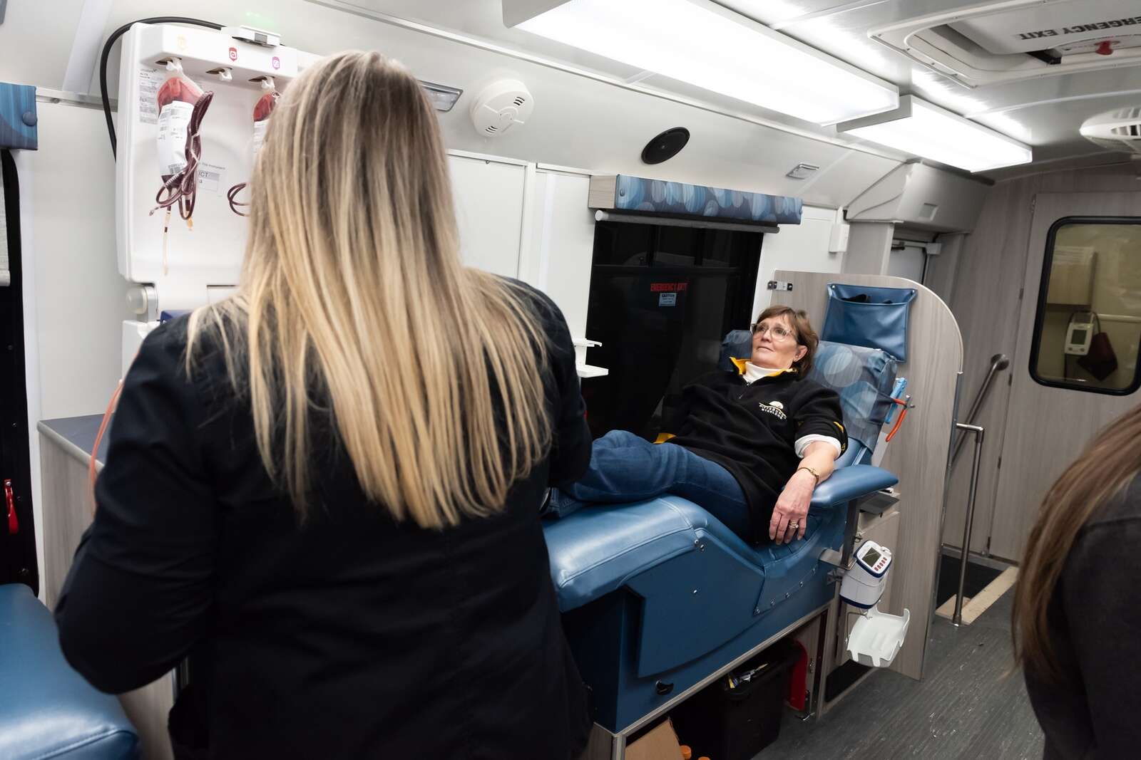 Laura Warmbrod donates blood as part of the Butler Community Blood Drive
