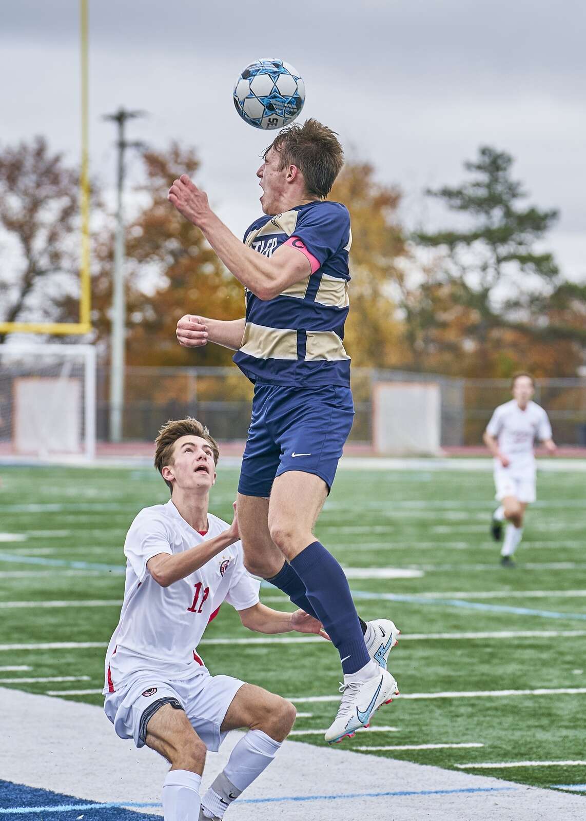 Butler's Oliver Chastain  heads the ball up the field