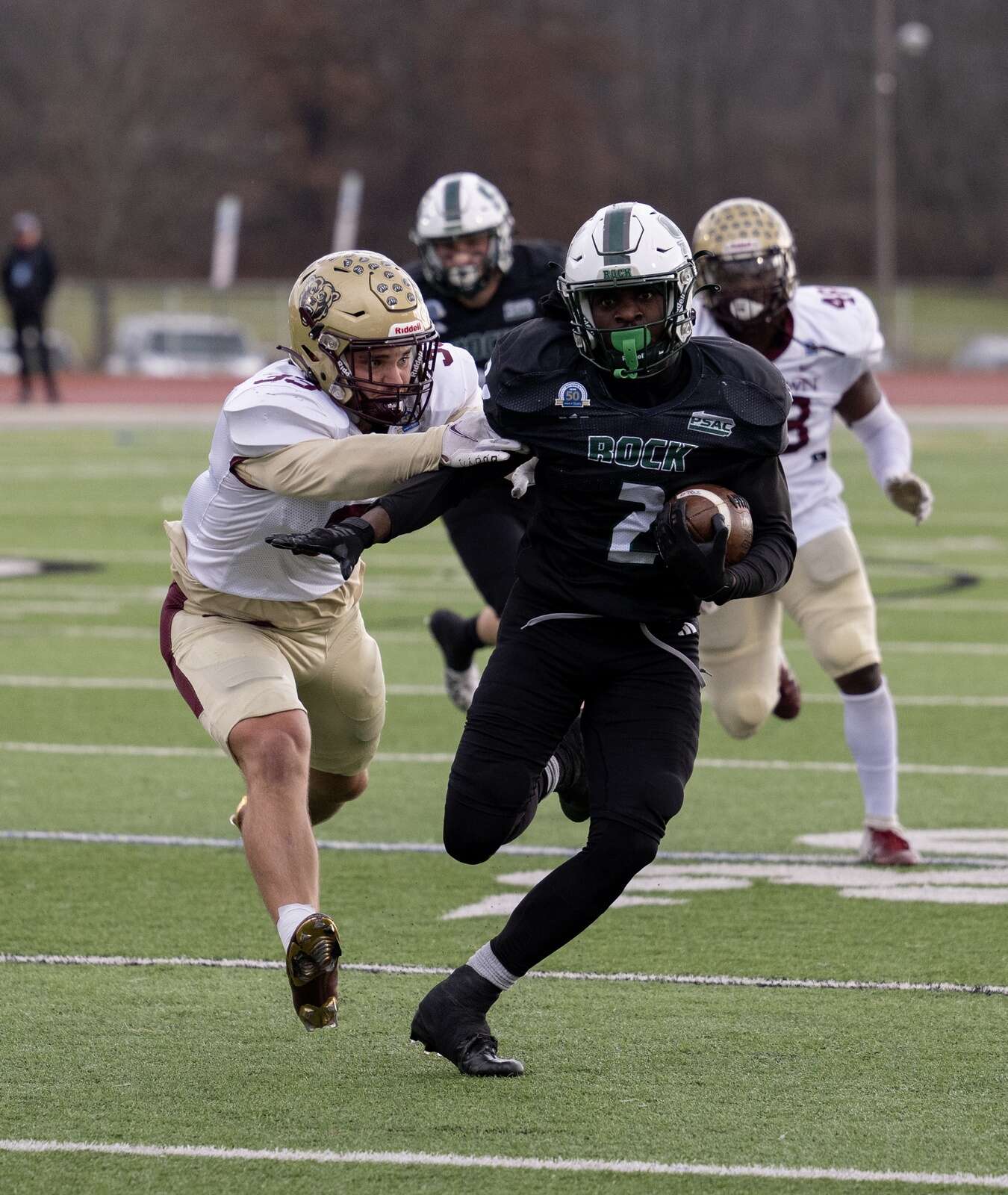 SRU's Khalid Dorsey (2) looks for the end zone