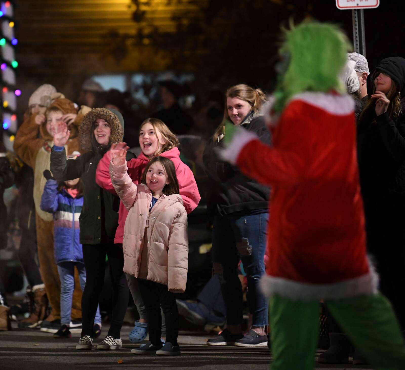 Children wave to Santa during the Saxonburg Holiday Parade