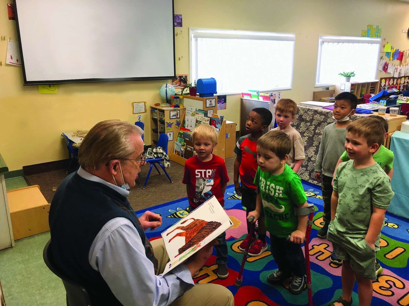 Daniel Musko reads to preschool students