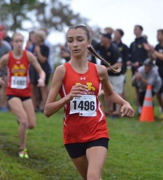 North Catholic freshman Gracie Plastino runs in a girls cross country meet 